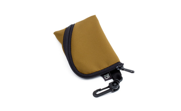 A Super Mini Ghost Whale Pouch in Coyote (golden tan).